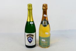 Two bottles of wine to include a 750ml bottle of Roger Barnier Curvee Demi-Sec Champagne. [2].