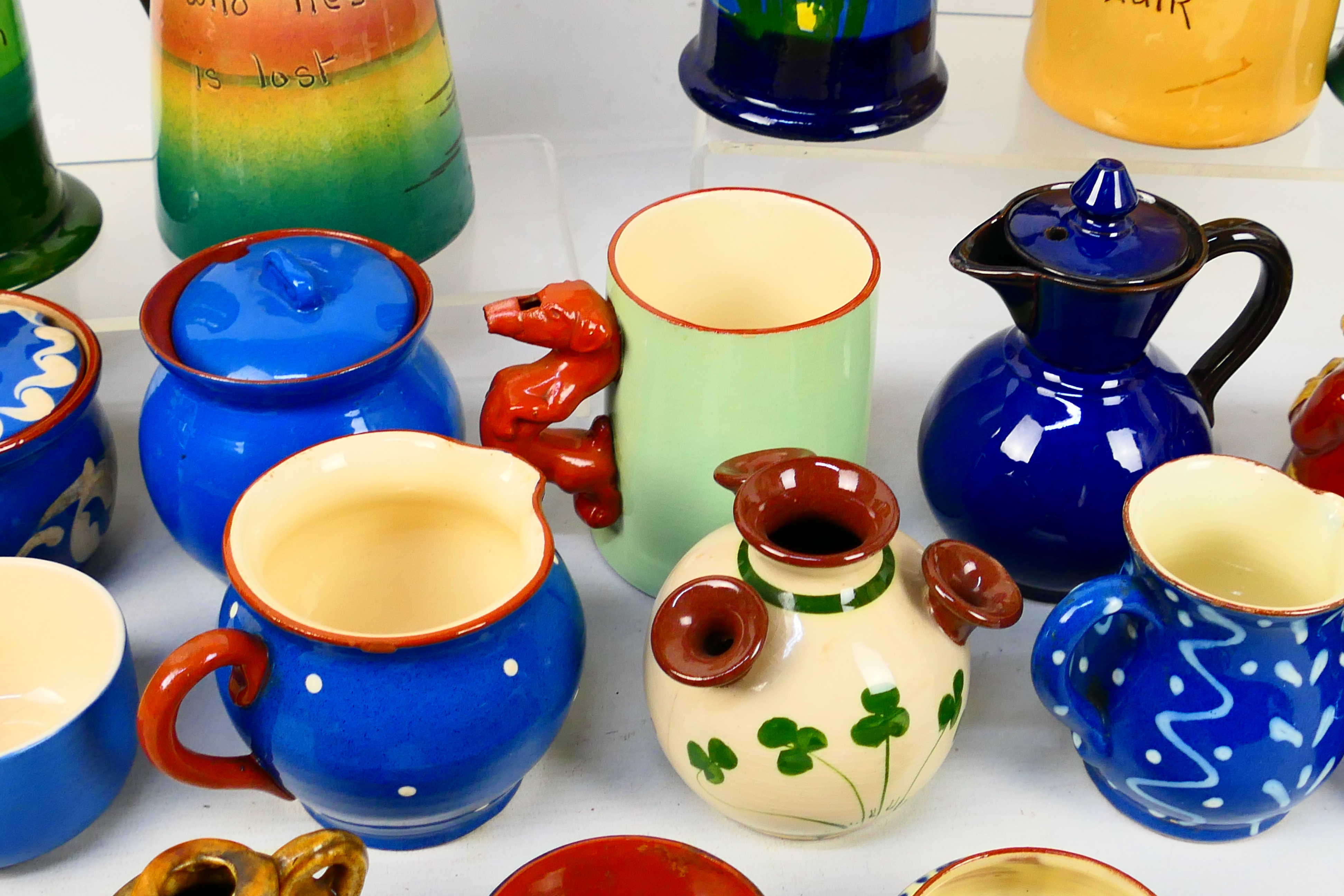 A collection of Torquay pottery wares to include bowls, jugs, cups and other, various manufacturers. - Image 18 of 20