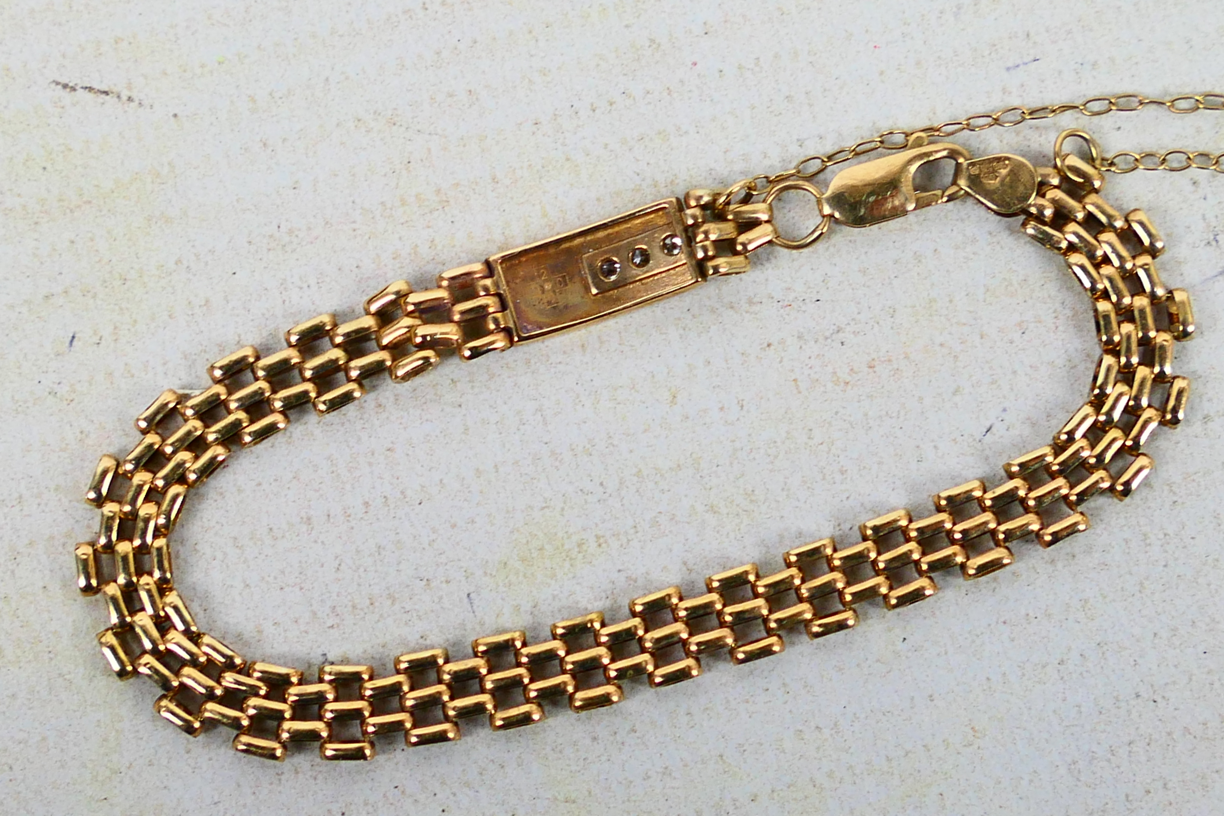 A 9ct yellow gold gate link bracelet set with three small diamonds, approximately 18 cm (l), 7. - Image 4 of 6