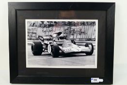 Formula One - A signed photographic print depicting Jackie Stewart driving for Tyrrell,