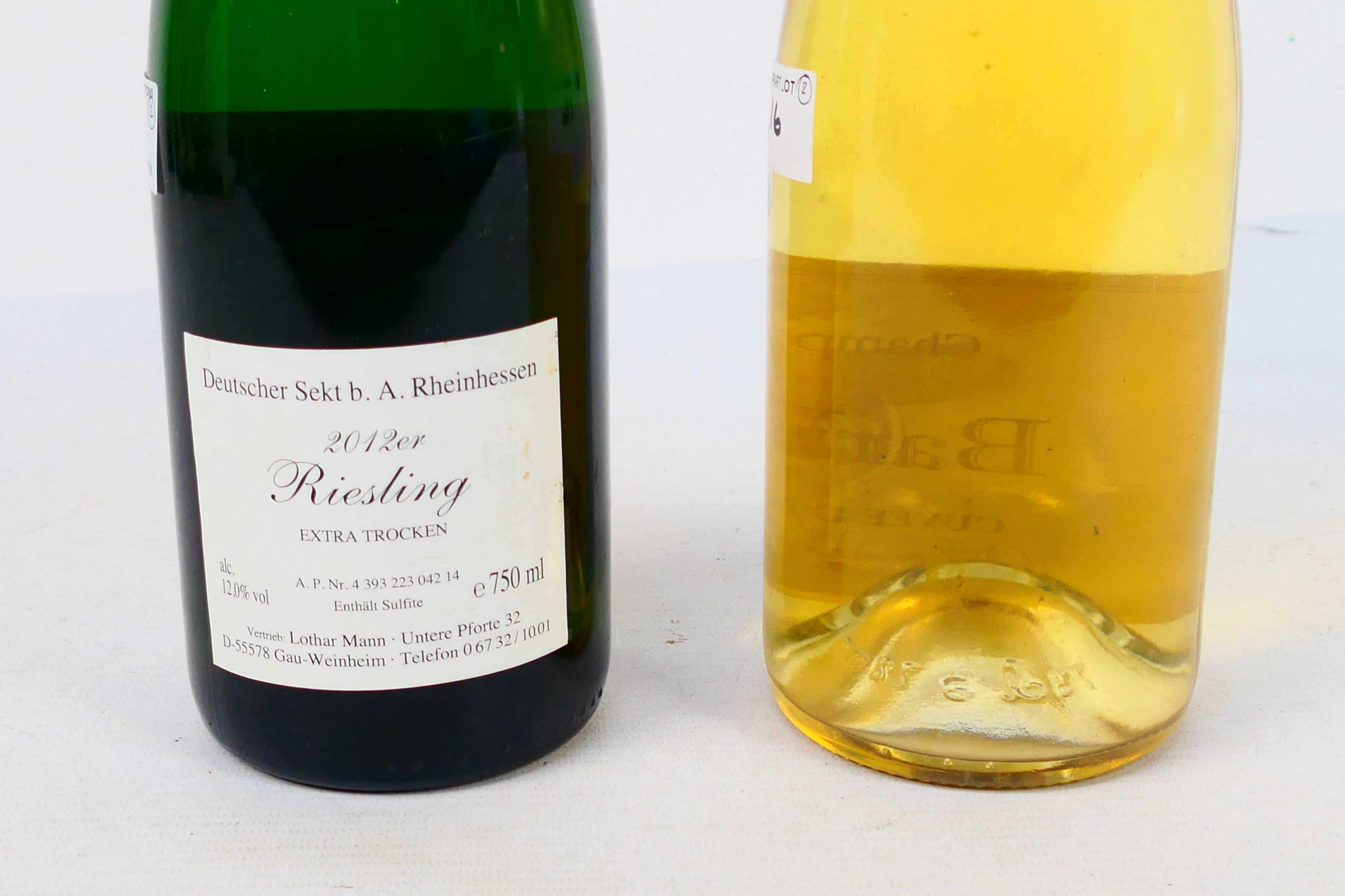Two bottles of wine to include a 750ml bottle of Roger Barnier Curvee Demi-Sec Champagne. [2]. - Image 4 of 5