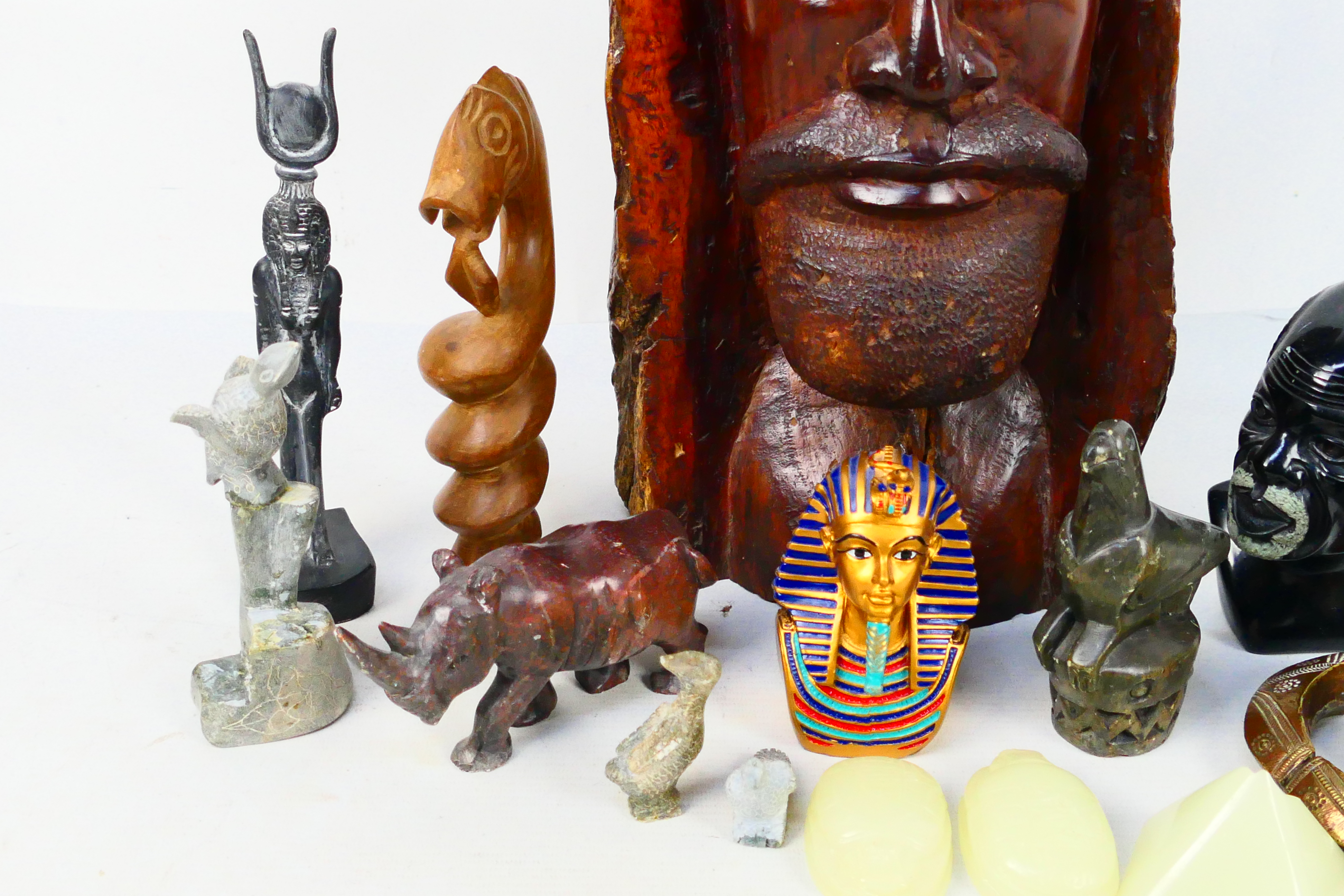 A quantity of Egyptian style and African tribal decorative objects to include stone busts, - Image 3 of 5