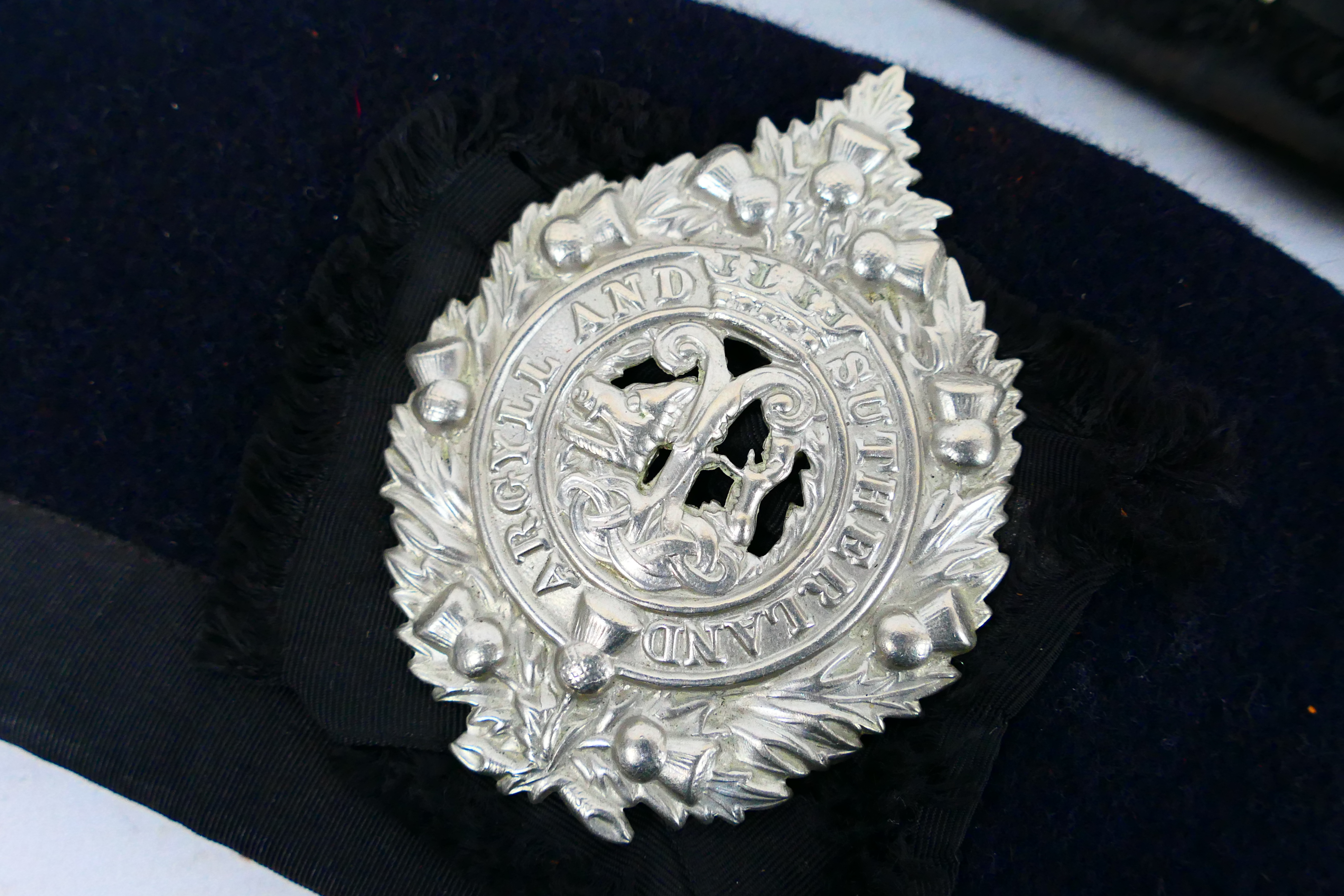 Two R Mackie & Co Scottish bonnet caps for Highland Regiment and Argyll And Sutherland Highlanders. - Image 2 of 7