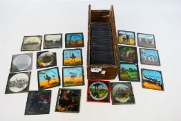 A collection of predominantly coloured glass slides with depictions of Arabian Nights,