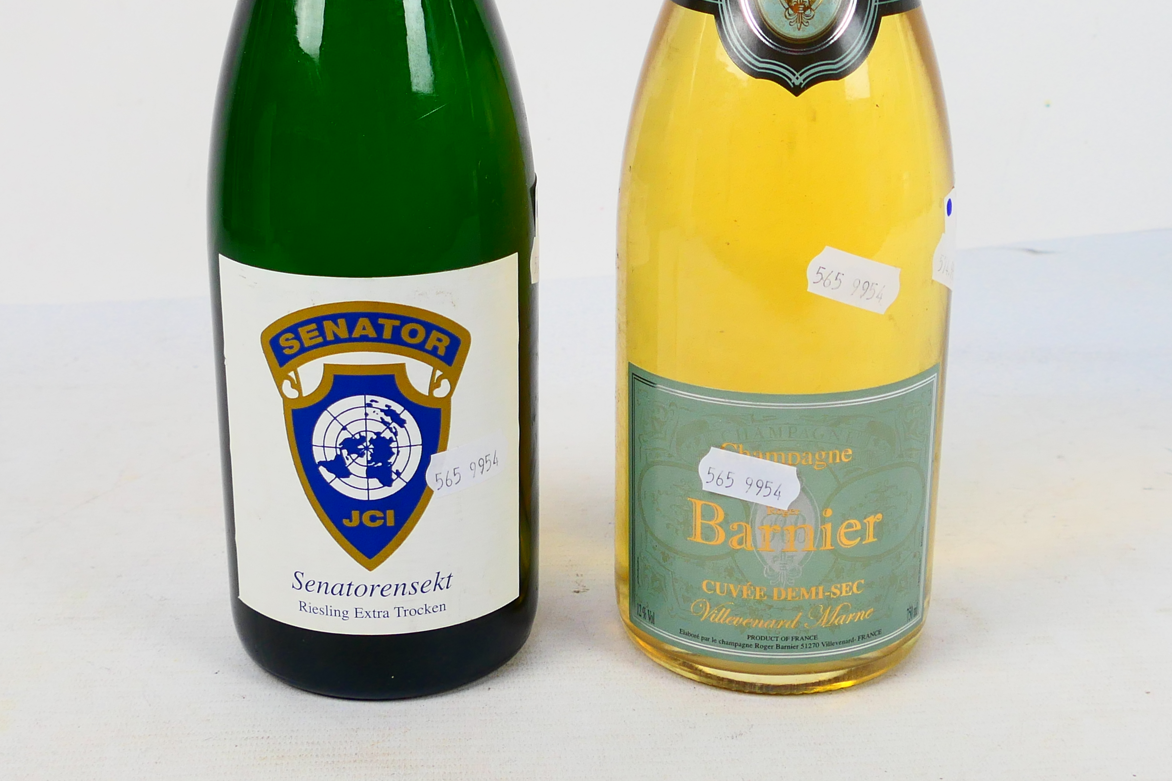 Two bottles of wine to include a 750ml bottle of Roger Barnier Curvee Demi-Sec Champagne. [2]. - Image 3 of 5