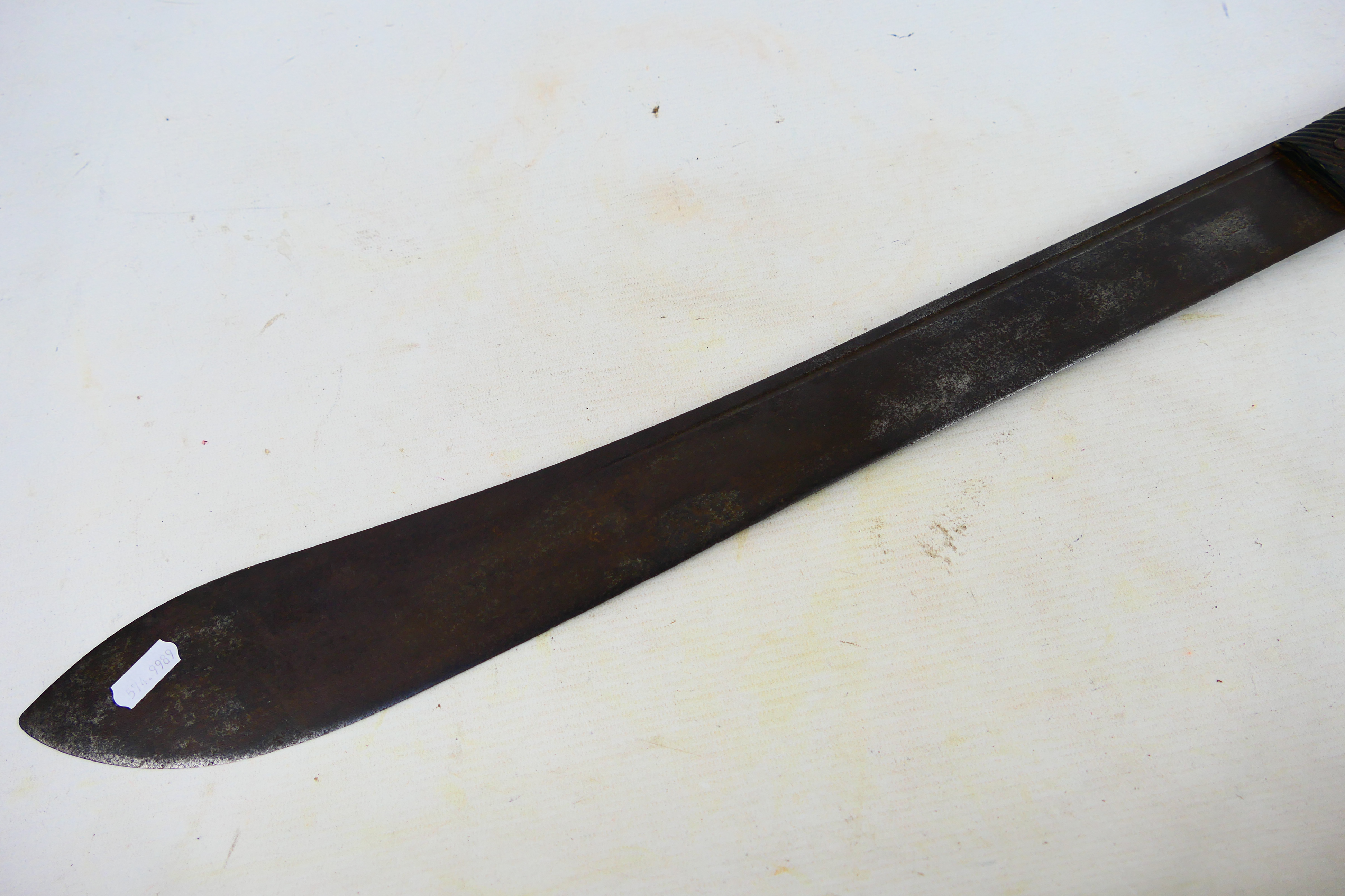 A 19th century machete with 55 cm (l) single fullered blade and ribbed horn grips, - Image 7 of 10