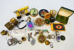 A mixed lot of collectables to include lorgnette opera glasses, sunglasses, powder compacts,