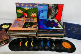 A collection of 12" vinyl records to include Thin Lizzy, David Bowie, Rolling Stones, Supertramp,