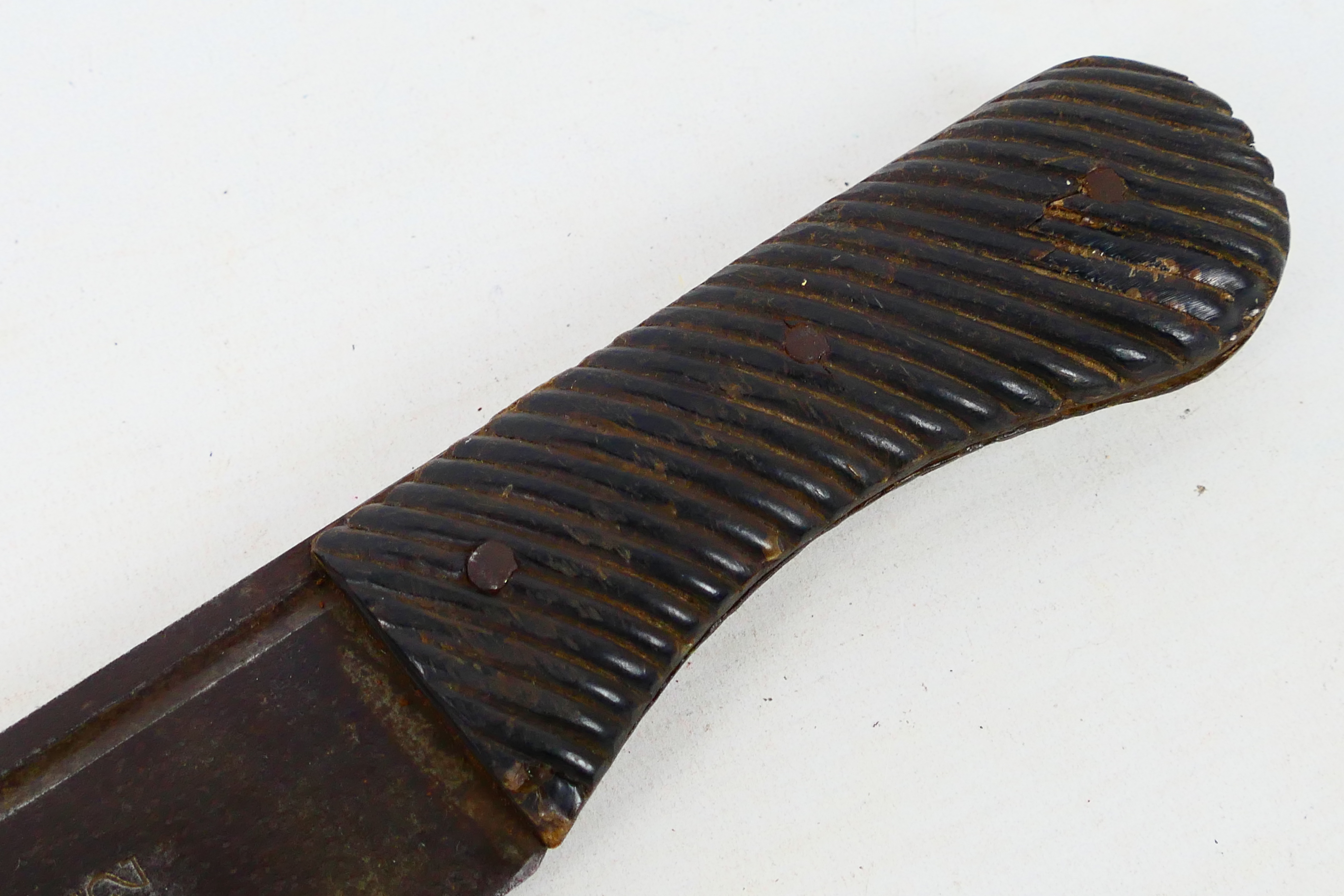 A 19th century machete with 55 cm (l) single fullered blade and ribbed horn grips, - Image 2 of 10