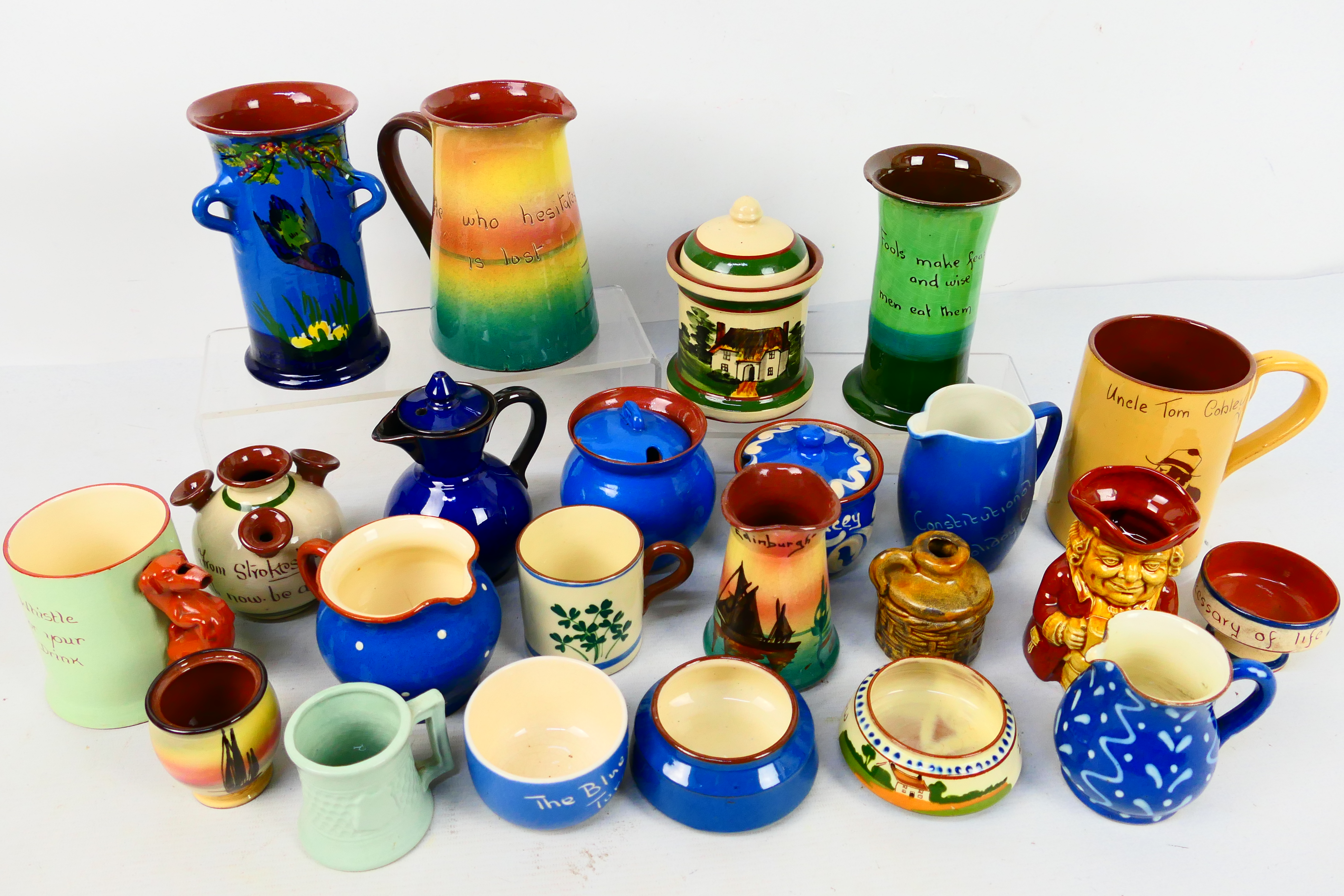 A collection of Torquay pottery wares to include bowls, jugs, cups and other, various manufacturers.