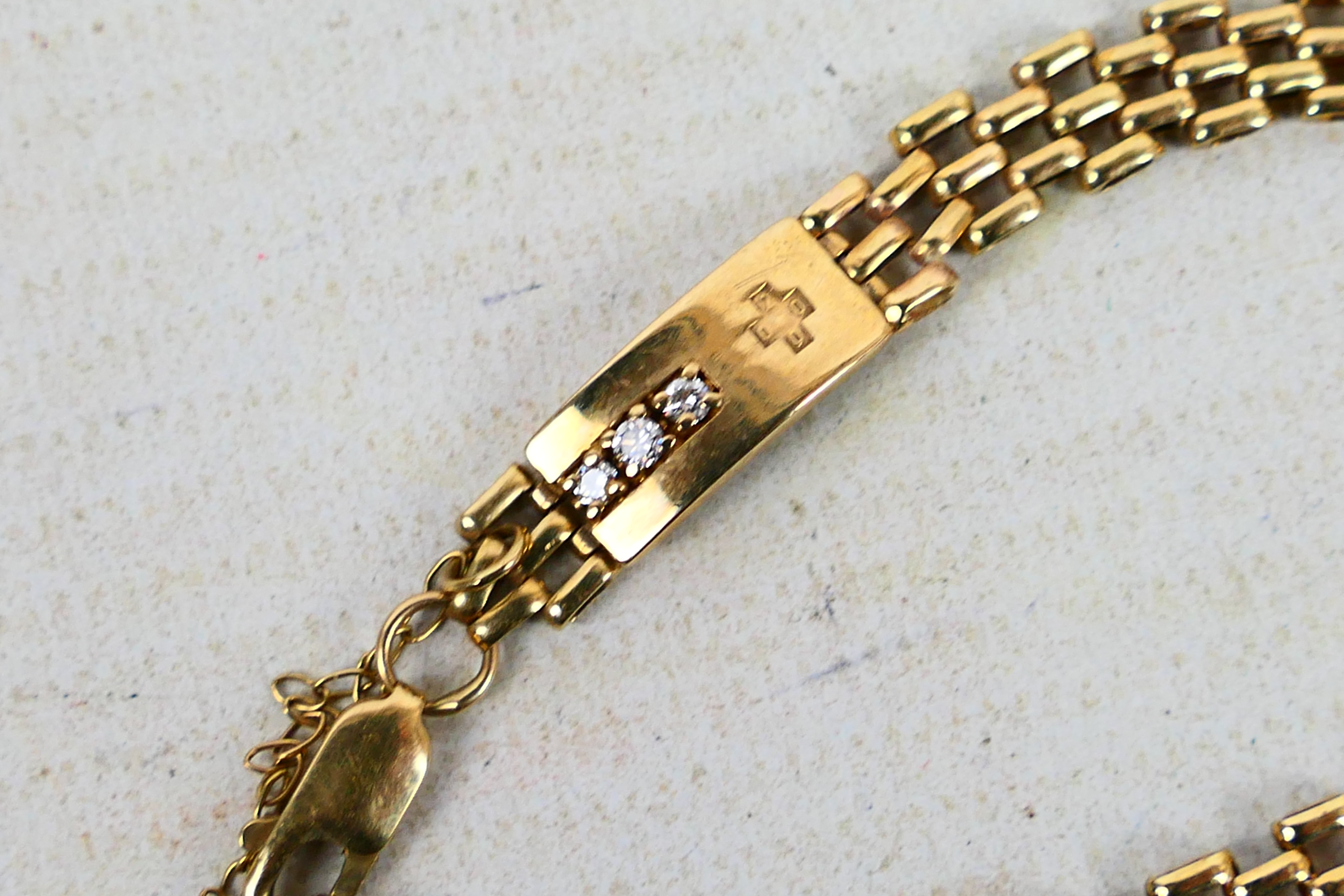 A 9ct yellow gold gate link bracelet set with three small diamonds, approximately 18 cm (l), 7. - Image 3 of 6