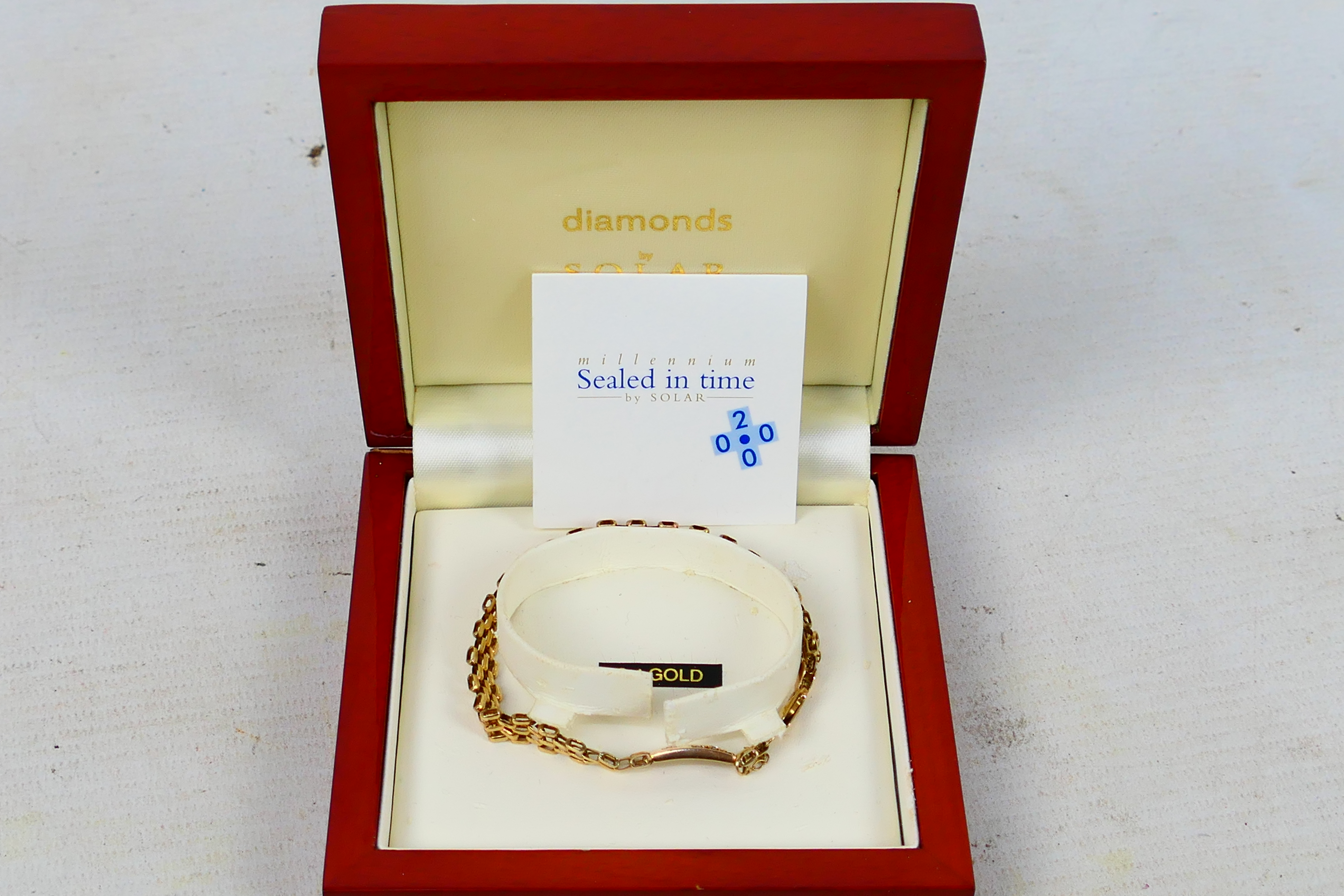 A 9ct yellow gold gate link bracelet set with three small diamonds, approximately 18 cm (l), 7. - Image 6 of 6