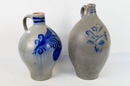 Two Westerwald style stoneware jugs, largest approximately 40 cm (h).
