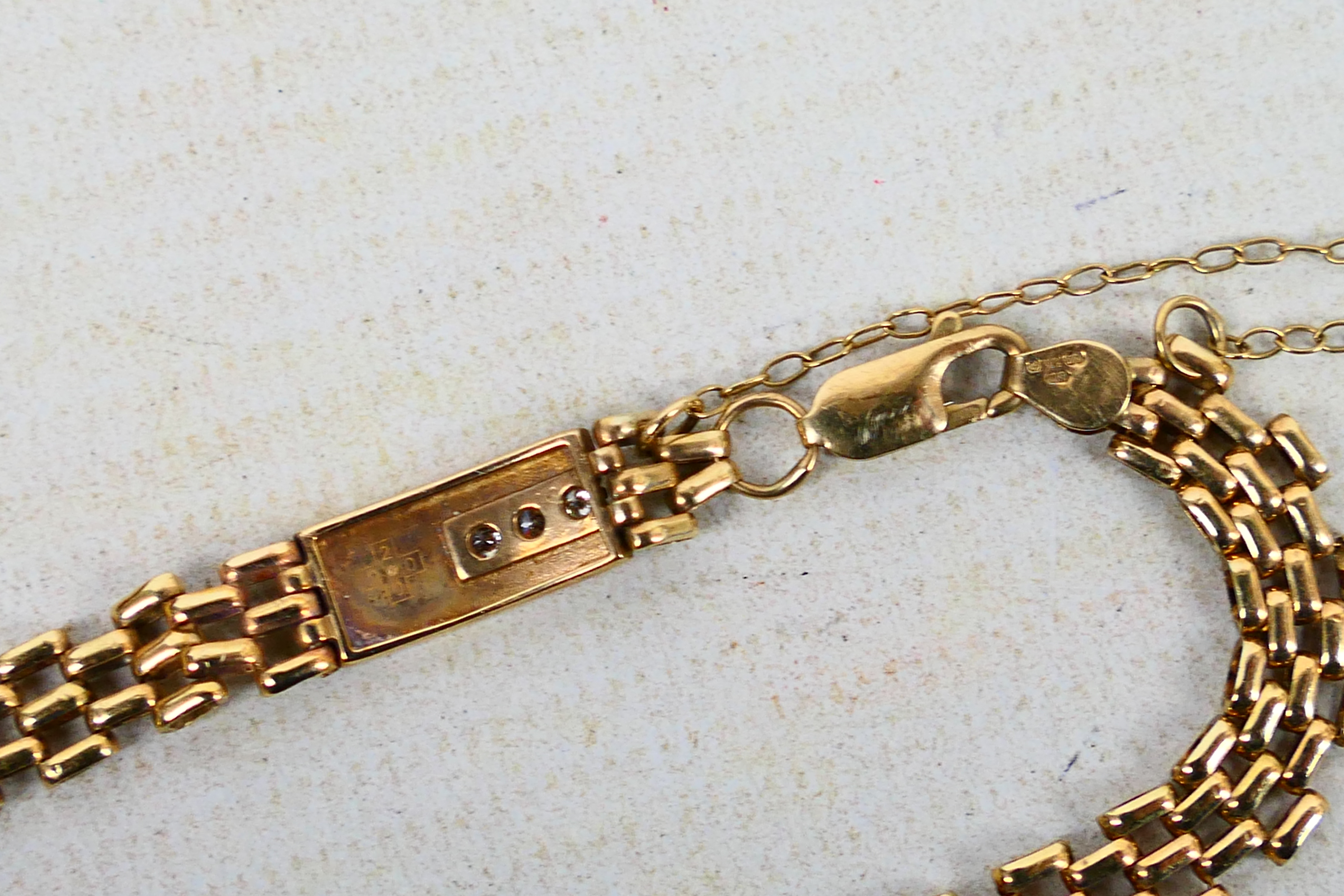 A 9ct yellow gold gate link bracelet set with three small diamonds, approximately 18 cm (l), 7. - Image 5 of 6