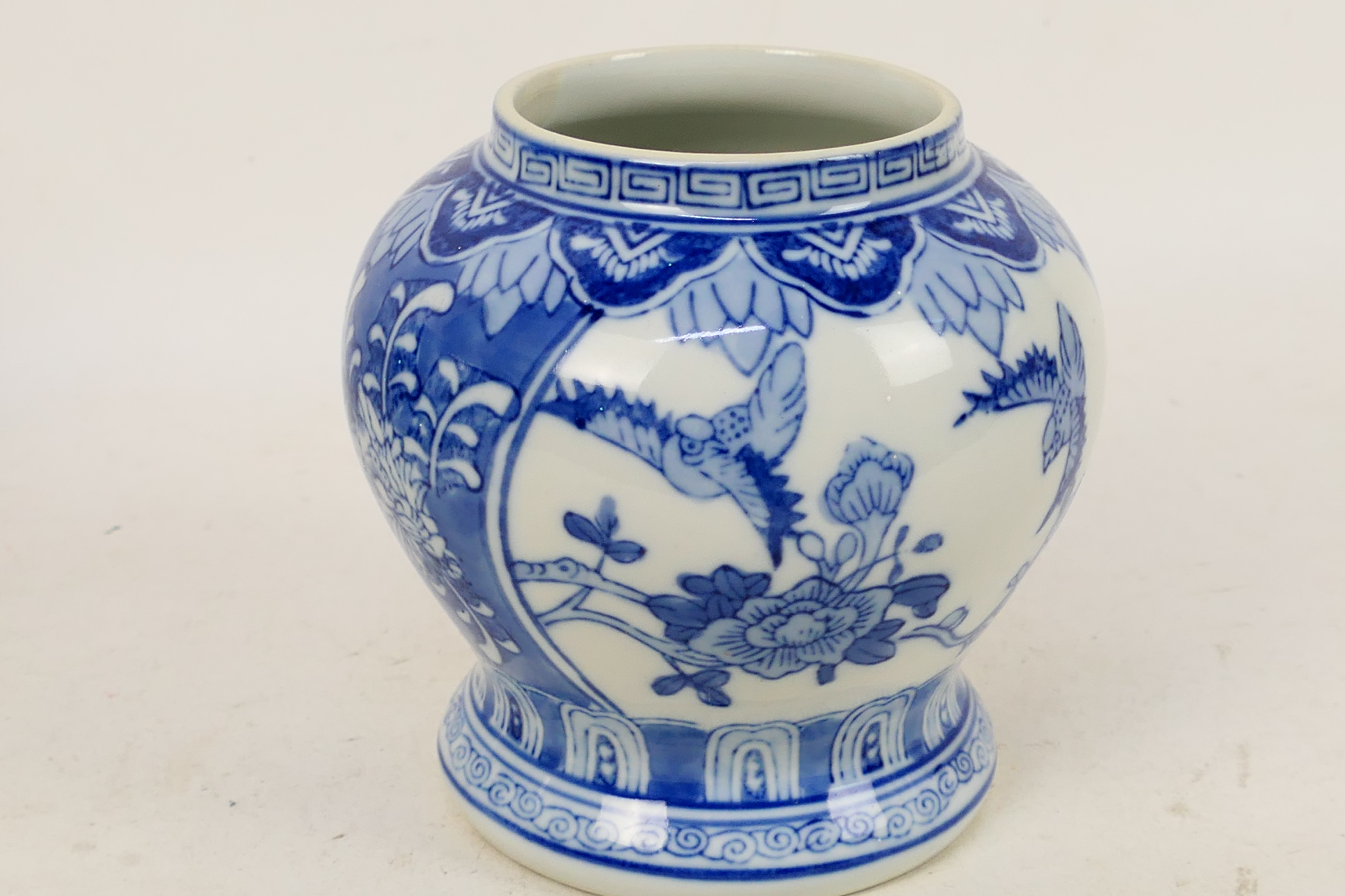 A blue and white vase of squat meiping form decorated with birds and flowers and a large blue and - Image 6 of 8