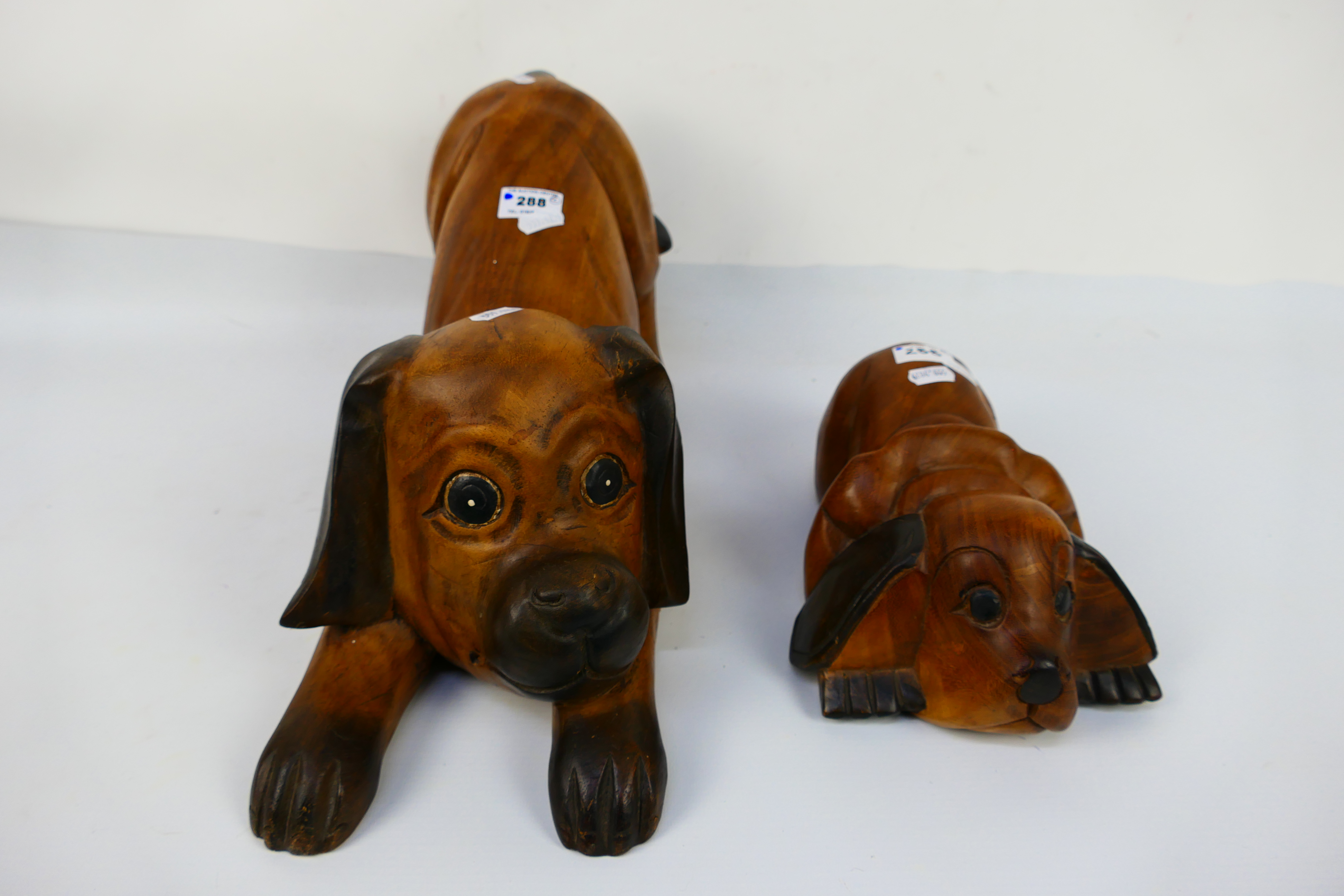 Two carved wood models of dogs, largest approximately 23 cm (h). [2]. - Image 3 of 3