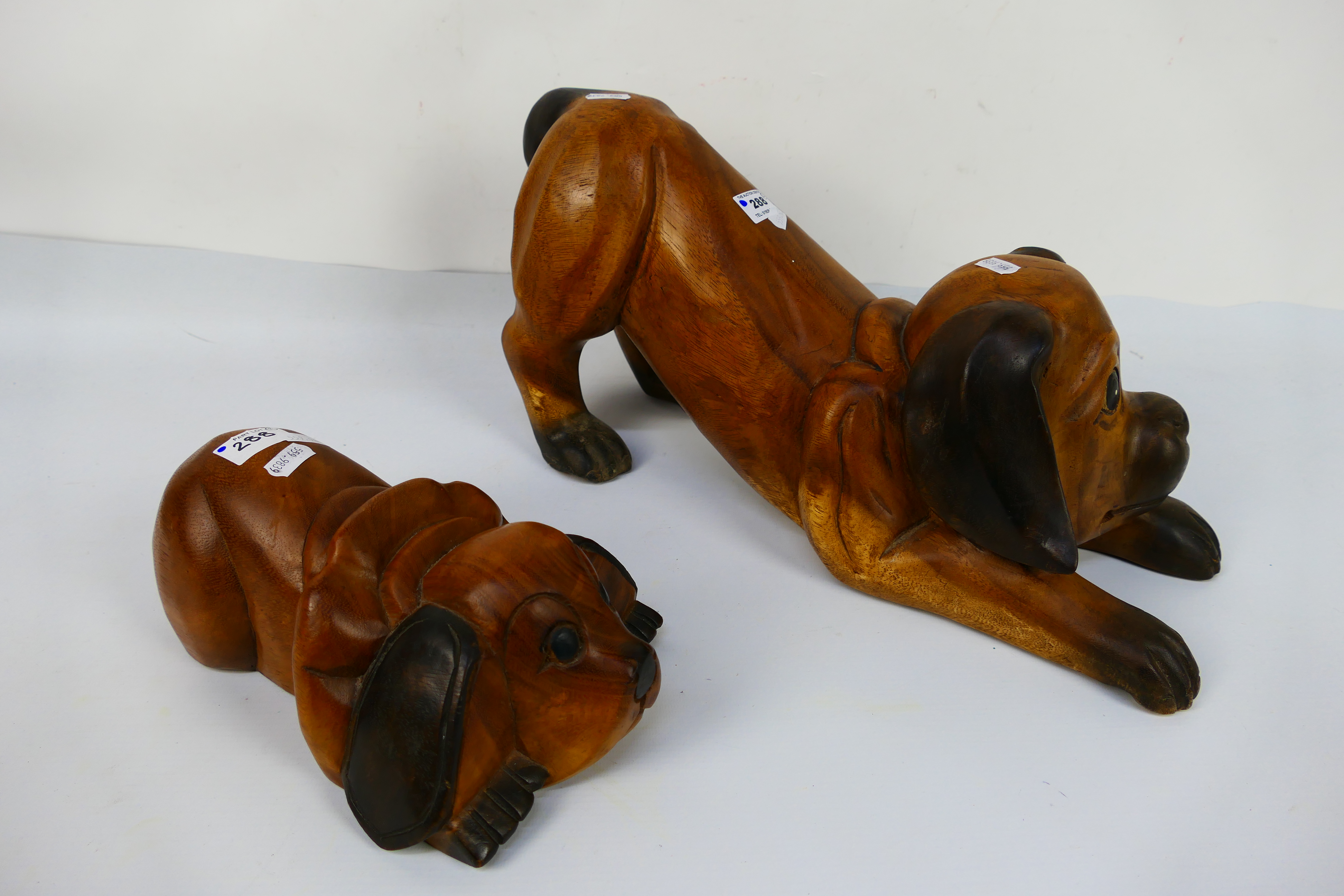 Two carved wood models of dogs, largest approximately 23 cm (h). [2]. - Image 2 of 3