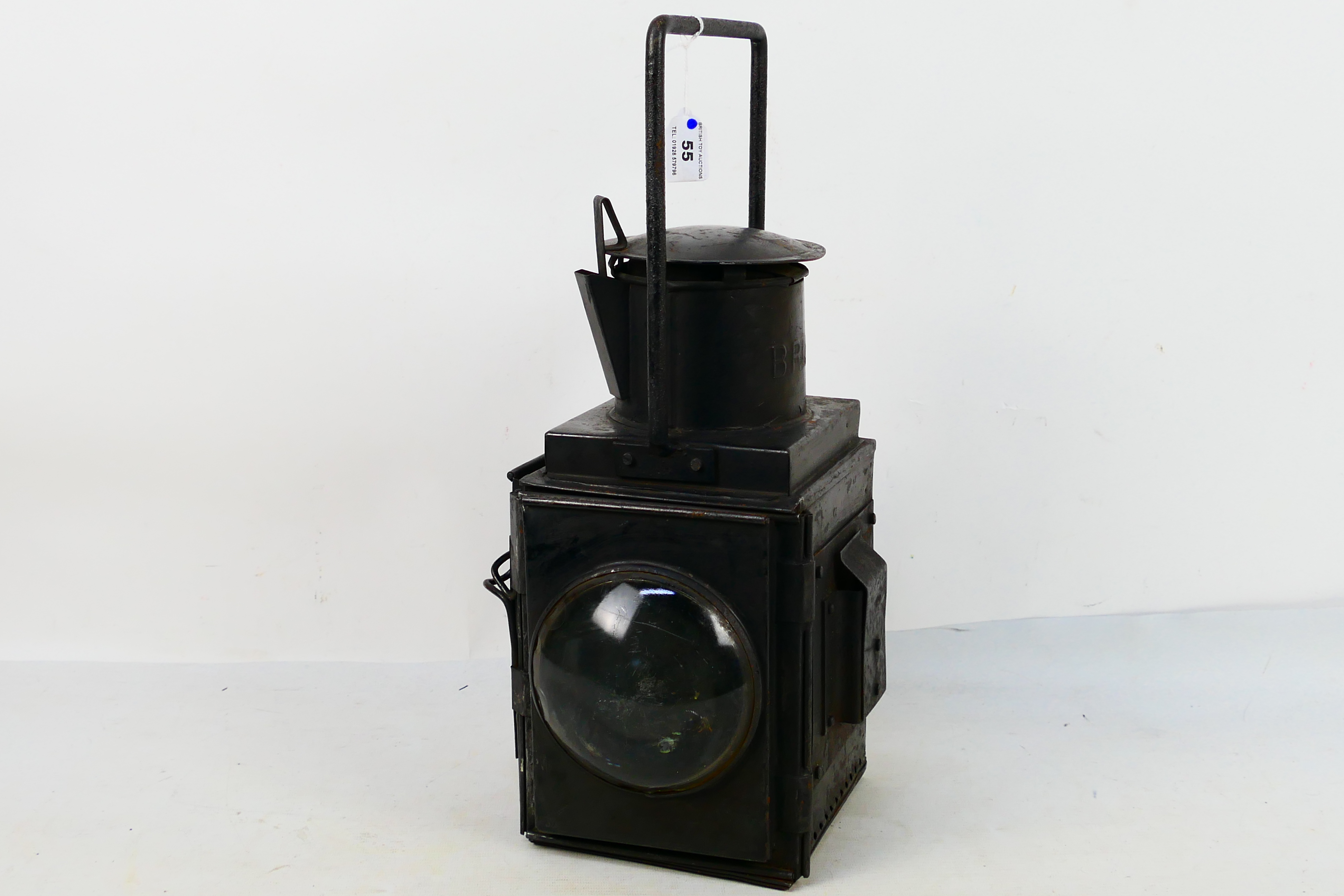 A BR(W) black painted side fitting brake van lamp with twin convex lenses and internal burner,