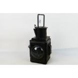 A BR(W) black painted side fitting brake van lamp with twin convex lenses and internal burner,