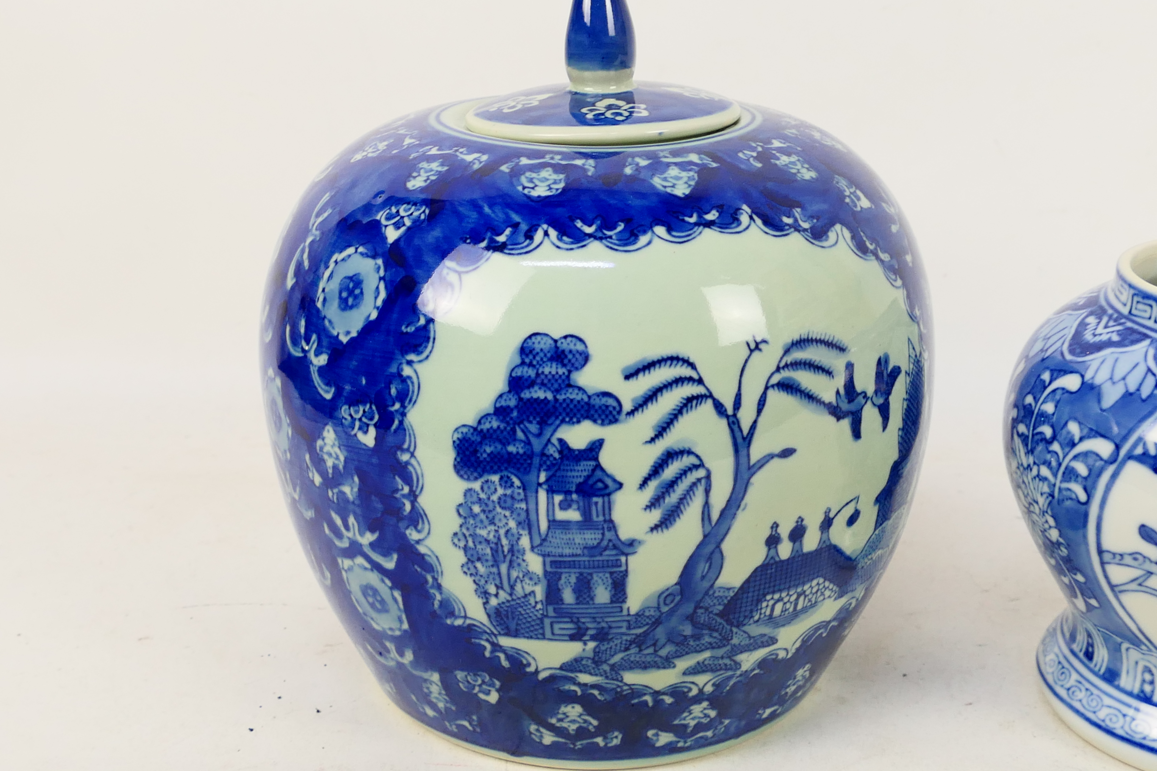 A blue and white vase of squat meiping form decorated with birds and flowers and a large blue and - Image 2 of 8