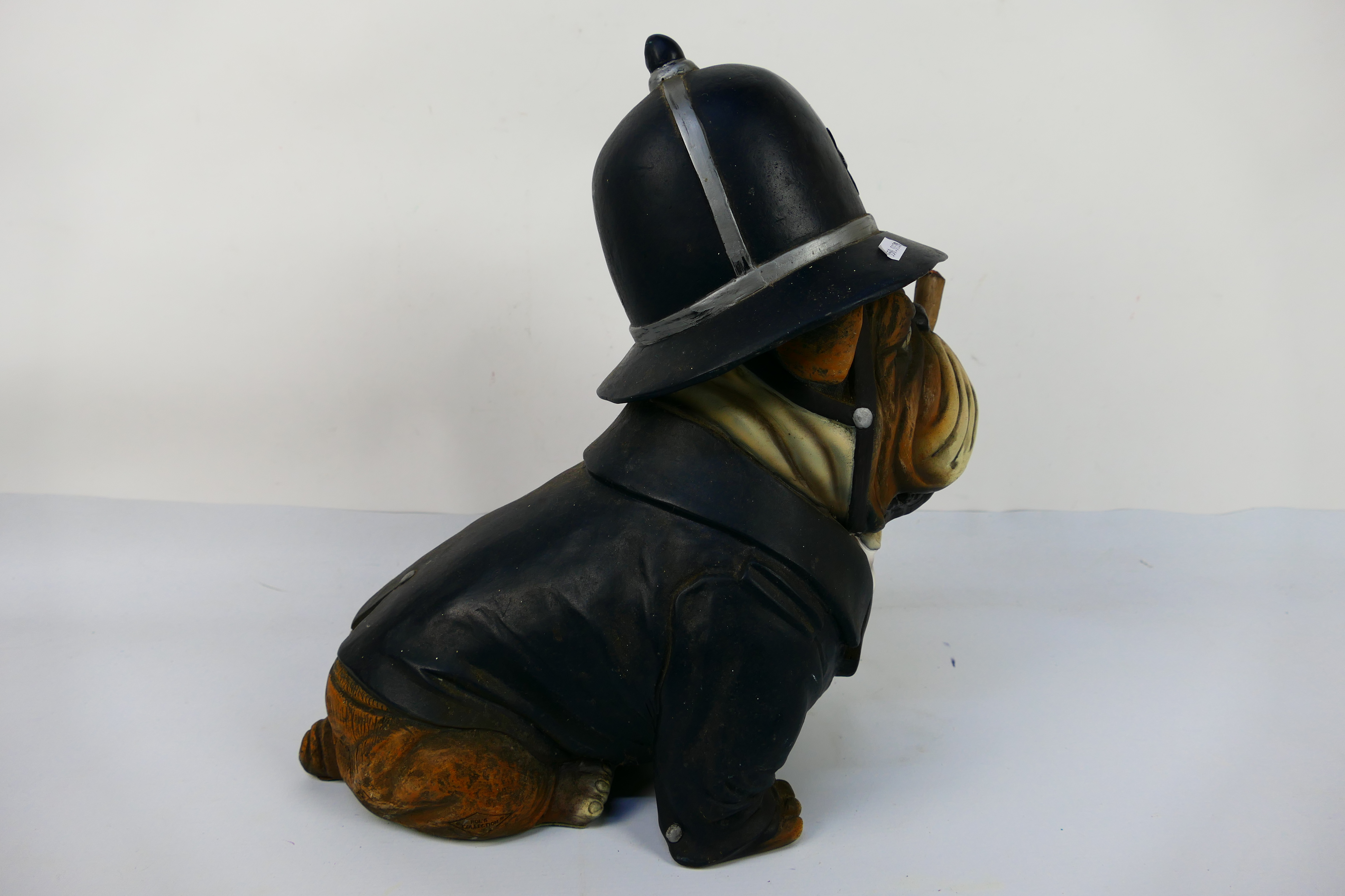 A model depicting an English Bulldog in police uniform smoking a cigar, approximately 39 cm (h). - Image 3 of 3