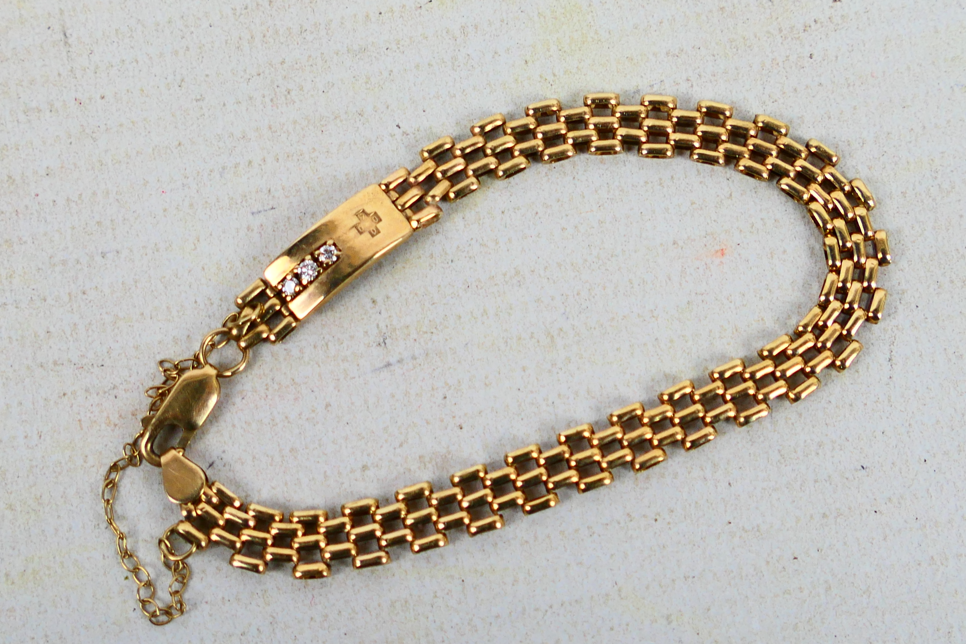 A 9ct yellow gold gate link bracelet set with three small diamonds, approximately 18 cm (l), 7. - Image 2 of 6