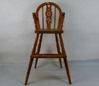 A pine high chair with footrest and pierced splat, 83 cm (h).