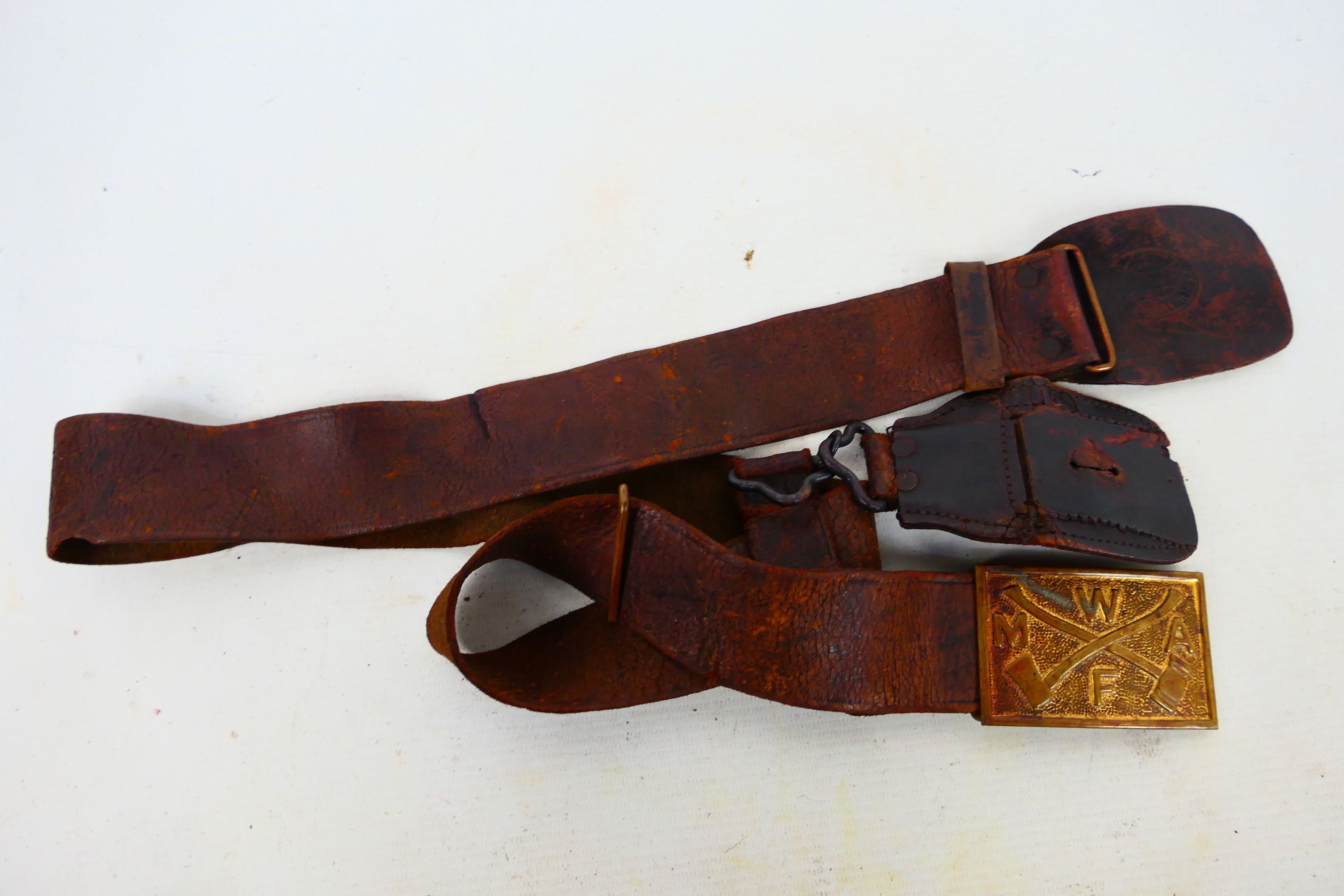 An antique leather belt with American forestry belt buckle.