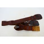 An antique leather belt with American forestry belt buckle.