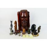 A quantity of Egyptian style and African tribal decorative objects to include stone busts,