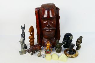 A quantity of Egyptian style and African tribal decorative objects to include stone busts,