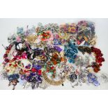 A collection of various costume jewellery, predominantly necklaces.