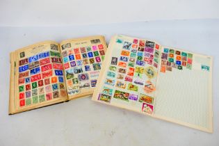 Philately - Two albums housing a collection of GB and world stamps.