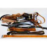 A collection of vintage leather belts and similar.