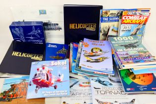 A collection of predominantly aviation related publications to include two binders of Helicopter