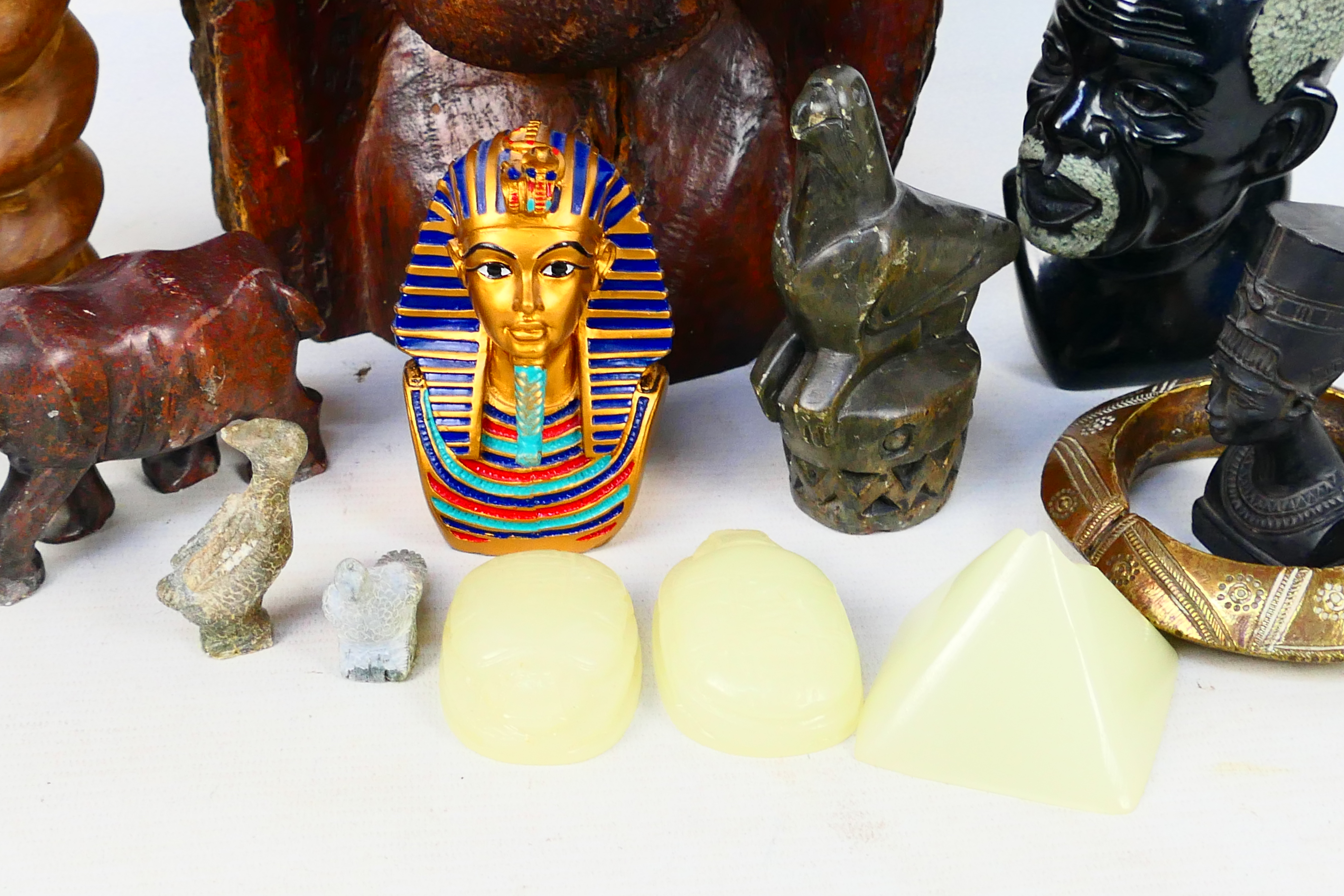 A quantity of Egyptian style and African tribal decorative objects to include stone busts, - Image 4 of 5