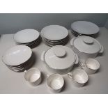 Thomas of Germany, a six place setting comprising graduated dinner plates in four sizes,