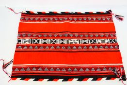 A native American style woven bag with geometric decoration, approximately 67 cm x 48 cm.