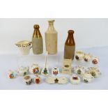 A small quantity of crested ware and stoneware bottles.