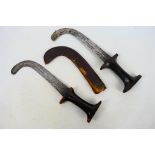 Ethnographica - Two Sudanese knives, curved steel blades with waisted grips,