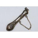 An attractive white metal toothpick holder, stamped 925, with repousse decoration,