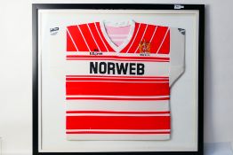 A framed Wigan Rugby League home shirt d