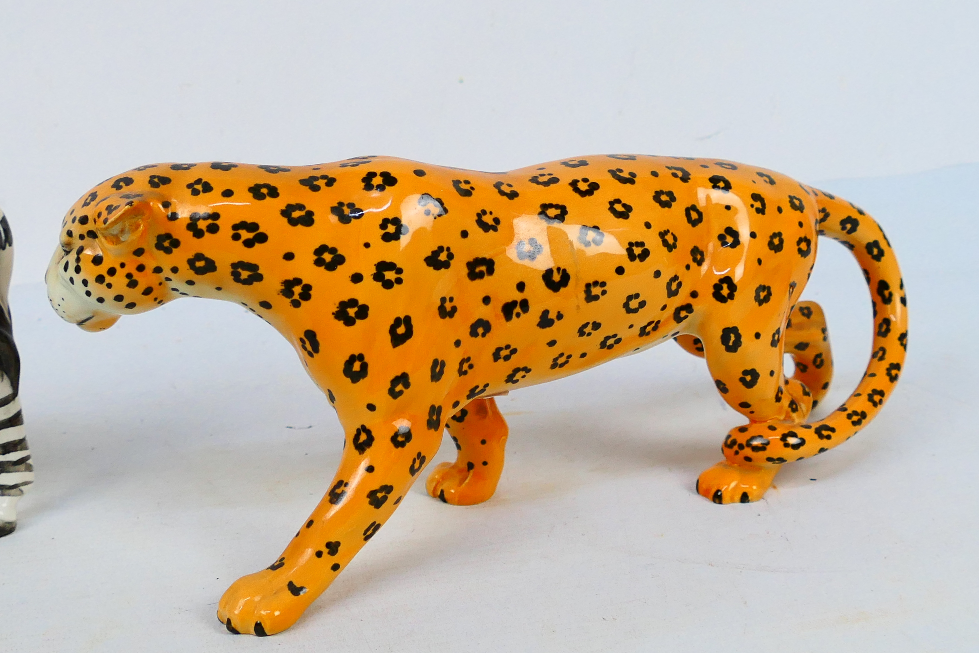 Two Beswick animal studies comprising leopard and zebra, largest approximately 30 cm (l). [2]. - Image 4 of 7