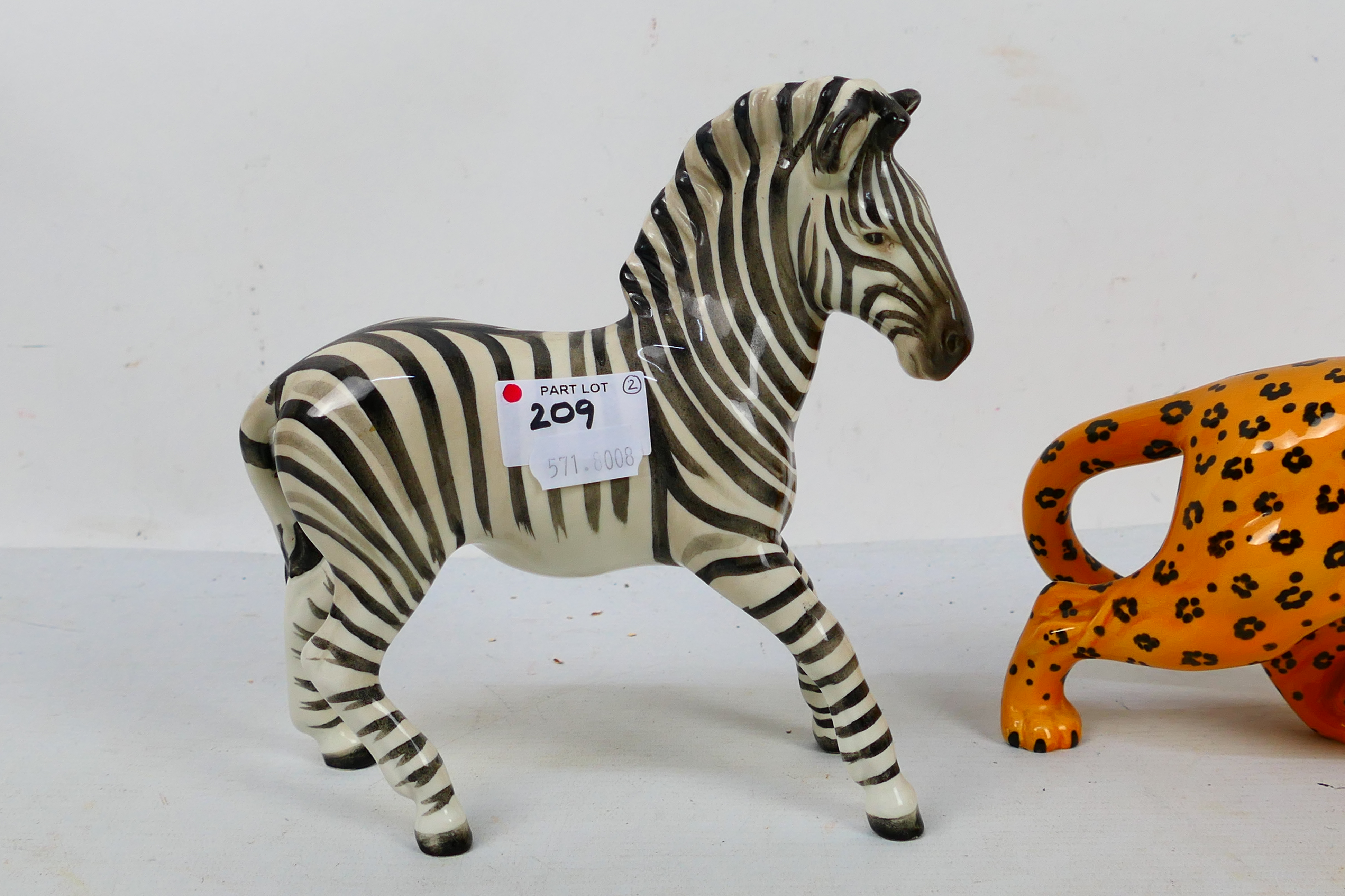 Two Beswick animal studies comprising leopard and zebra, largest approximately 30 cm (l). [2]. - Image 3 of 7