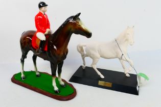 A John Beswick Spirit Of The Wind equine study on wooden plinth and one similar,