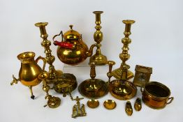 A box of mixed brassware to include candlesticks, carriage clock and similar.