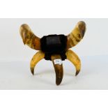 An unusual antique table snuff mull formed from cow horns, approximately 29 cm.