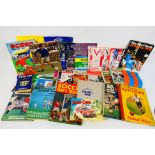 Lot to include football annuals, rugby league programmes, cricket and football books,