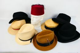 A varied collection of gentleman's hats.