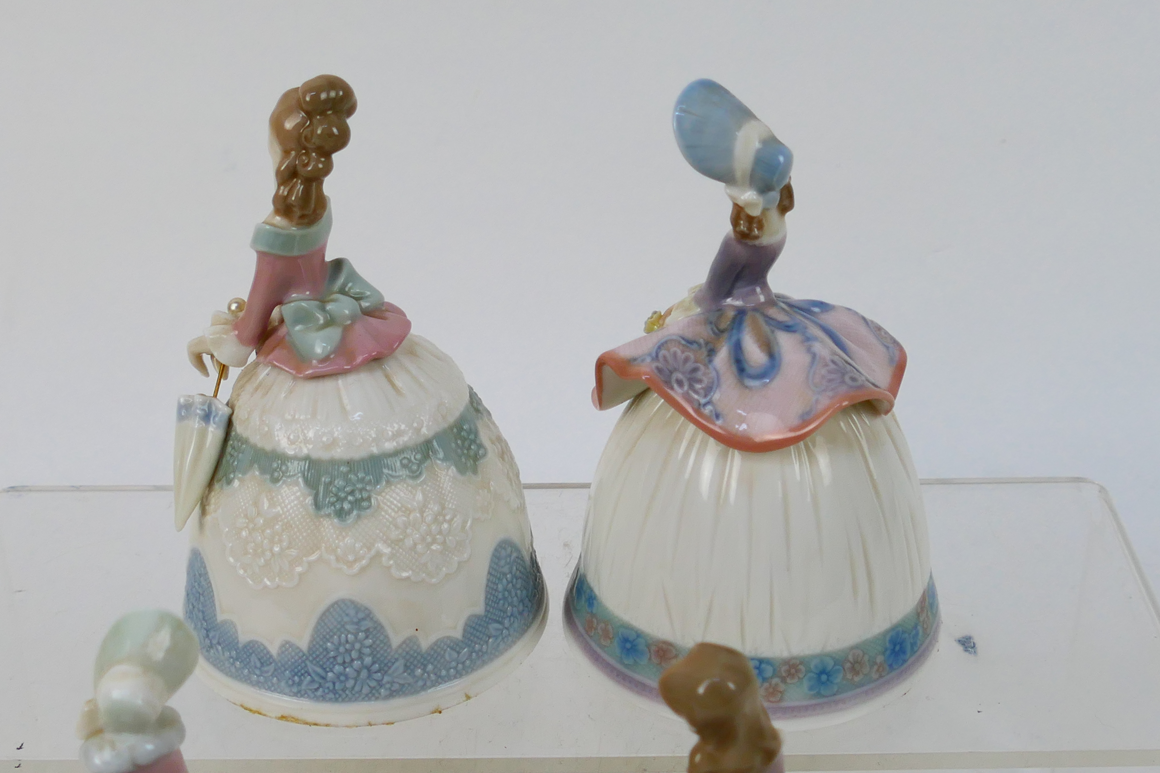 Lladro - Four porcelain bells in the form of ladies, approximately 12 cm (h). - Image 5 of 6